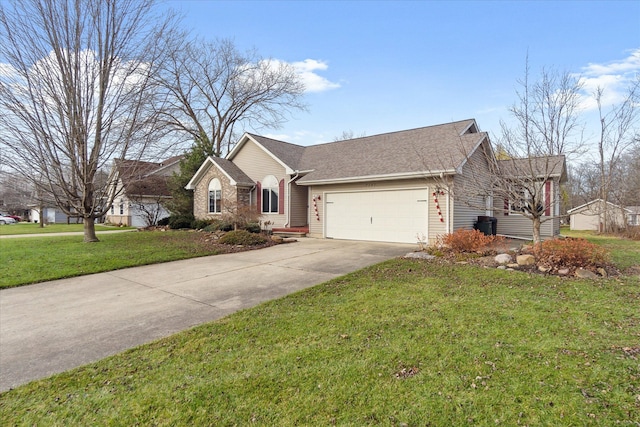 single story home featuring a garage and a front lawn