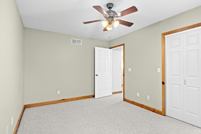 5279 Vinton Rd, Williamsburg, MI 49690 - unfurnished bedroom with baseboards, carpet, and a ceiling fan