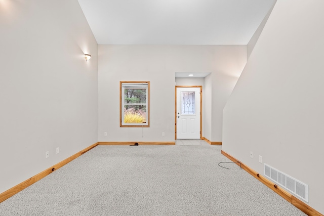 5279 Vinton Rd, Williamsburg, MI 49690 - unfurnished room with baseboards and light carpet
