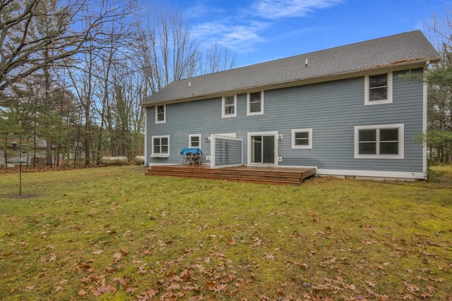 5279 Vinton Rd, Williamsburg, MI 49690 - back of house featuring a wooden deck and a yard