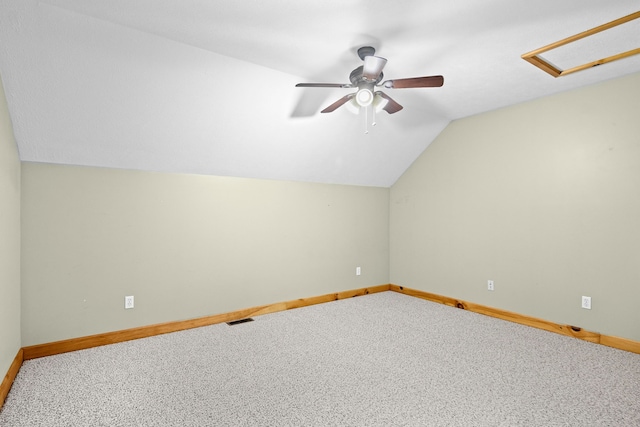 5279 Vinton Rd, Williamsburg, MI 49690 - bonus room featuring lofted ceiling, baseboards, a ceiling fan, and carpet floors