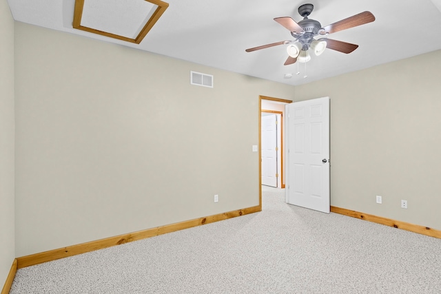 5279 Vinton Rd, Williamsburg, MI 49690 - carpeted empty room with baseboards, attic access, and a ceiling fan