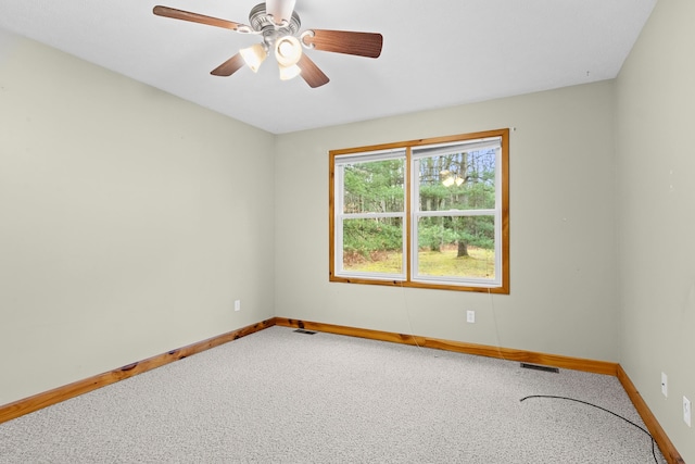5279 Vinton Rd, Williamsburg, MI 49690 - carpeted empty room with baseboards and a ceiling fan
