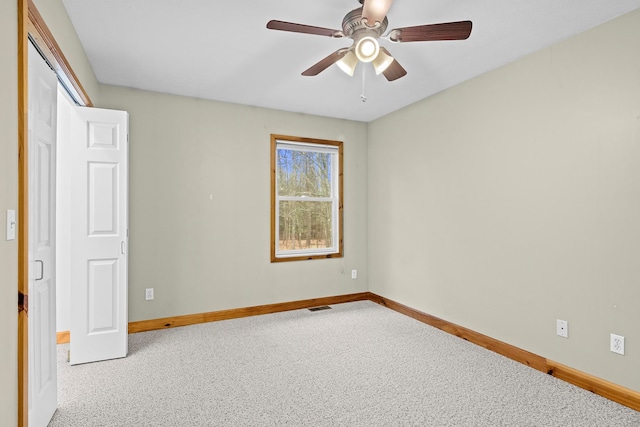 5279 Vinton Rd, Williamsburg, MI 49690 - unfurnished bedroom featuring baseboards, carpet floors, and ceiling fan