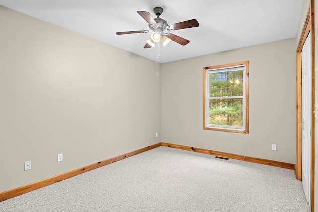 5279 Vinton Rd, Williamsburg, MI 49690 - carpeted spare room featuring baseboards and ceiling fan