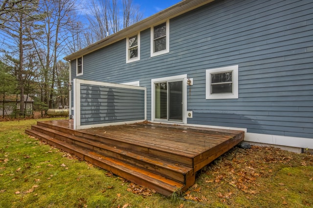5279 Vinton Rd, Williamsburg, MI 49690 - rear view of house with a wooden deck