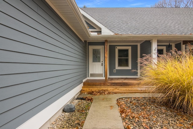 5279 Vinton Rd, Williamsburg, MI 49690 - doorway to property featuring a porch and roof with shingles