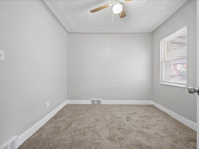 15778 Appoline St, Detroit, MI 48227 - carpeted spare room featuring a textured ceiling, baseboards, and a ceiling fan