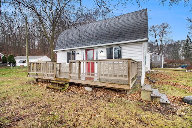 wooden terrace with a yard