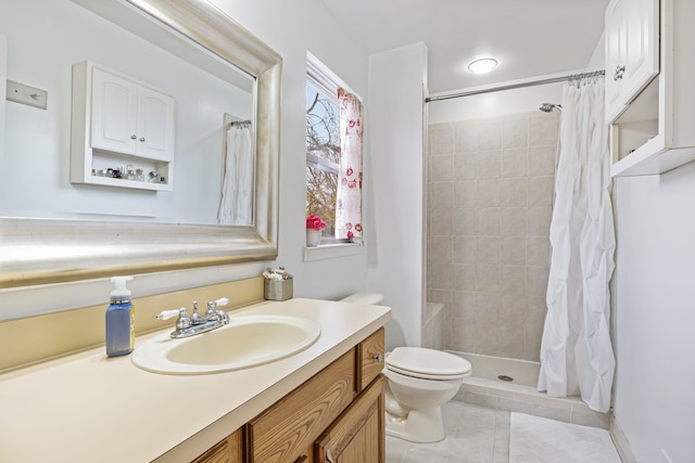 bathroom featuring tile patterned floors, vanity, a shower with shower curtain, and toilet