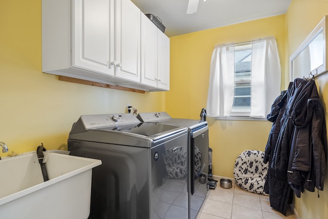 laundry room with cabinets, ceiling fan, sink, separate washer and dryer, and light tile patterned flooring