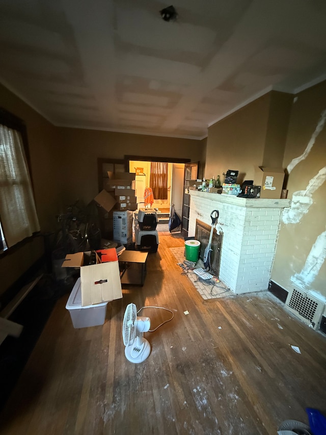 dining room with hardwood / wood-style floors and crown molding