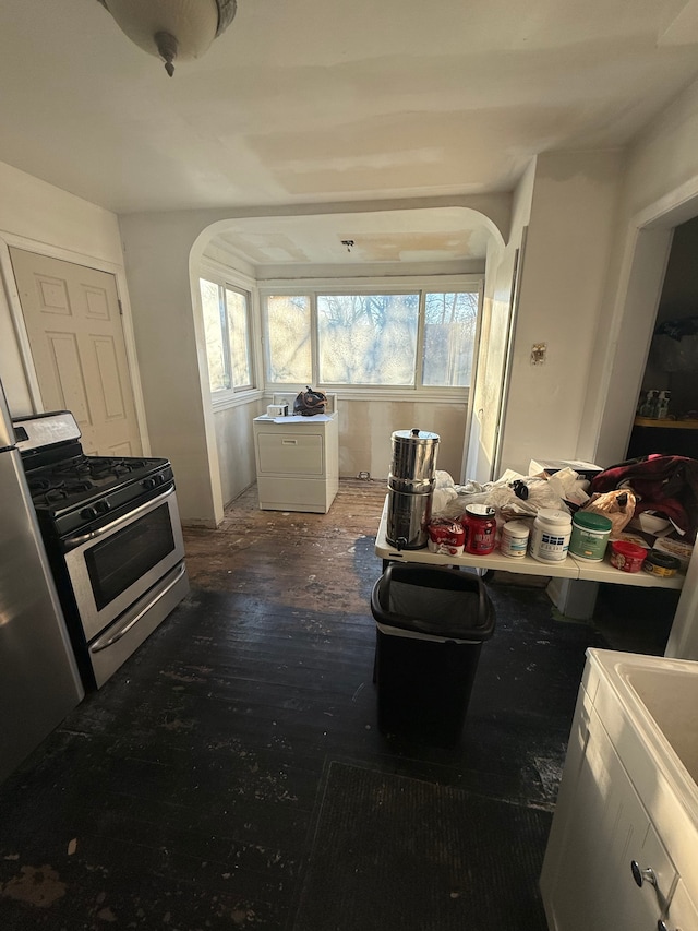 interior space with gas stove and dark wood-type flooring