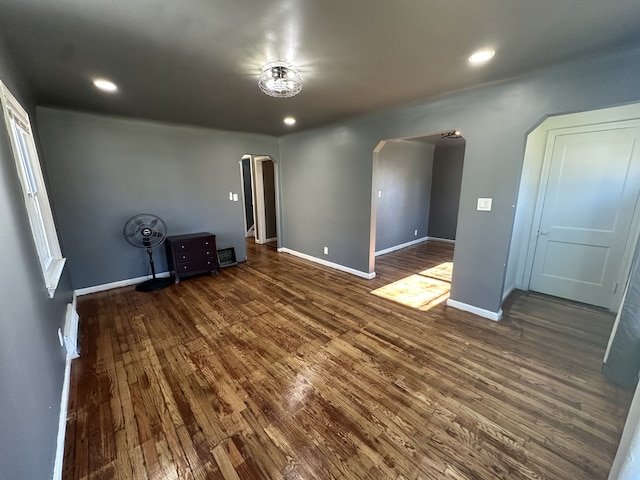 unfurnished bedroom featuring dark hardwood / wood-style floors