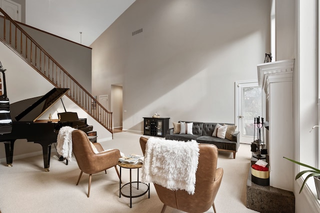 carpeted living room featuring high vaulted ceiling