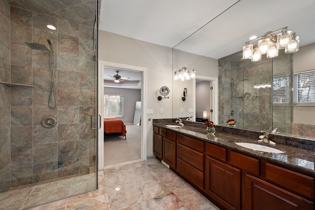 bathroom featuring vanity, a shower with door, and ceiling fan