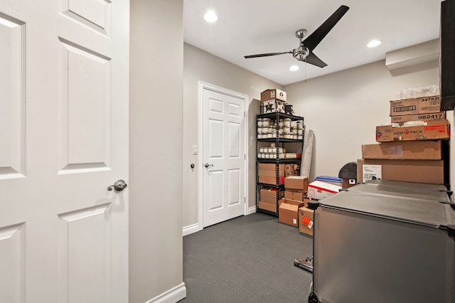 carpeted office with ceiling fan