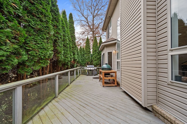 wooden deck featuring area for grilling