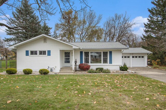 ranch-style house with a front yard and a garage