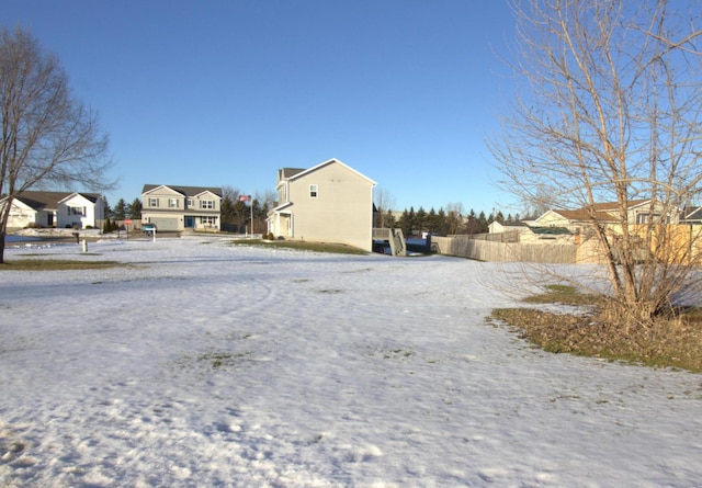 view of yard with a residential view and fence