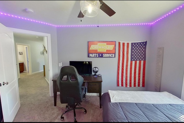carpeted bedroom featuring baseboards and a ceiling fan