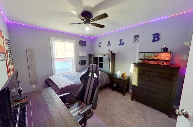 bedroom featuring a ceiling fan and carpet