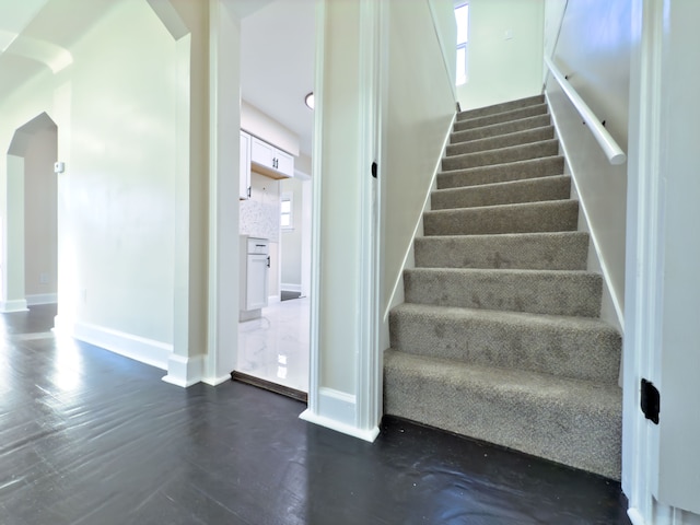 stairs with concrete floors