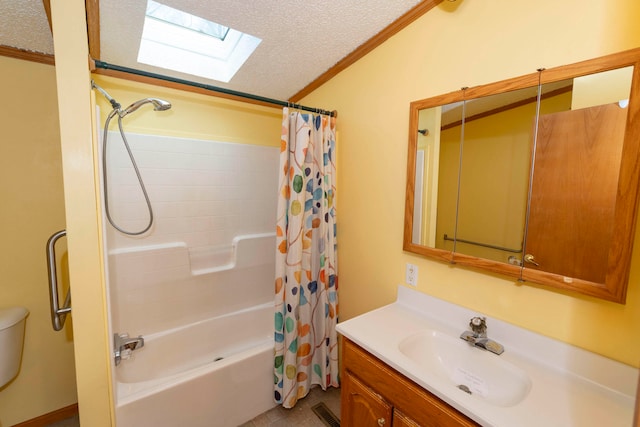 full bathroom featuring vanity, a skylight, ornamental molding, a textured ceiling, and shower / tub combo