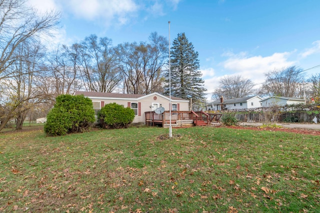 exterior space with a wooden deck and a yard