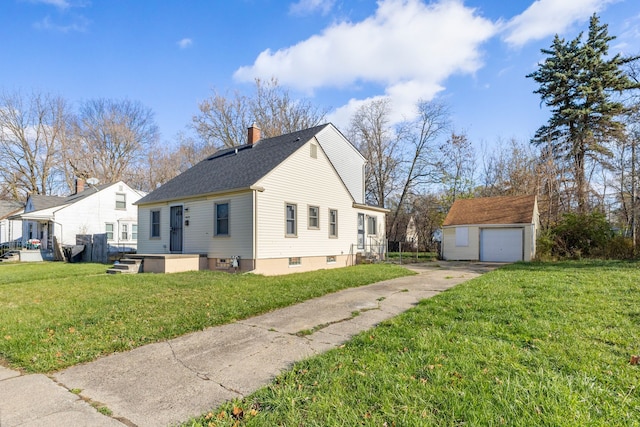 view of side of property with a garage, an outdoor structure, and a lawn