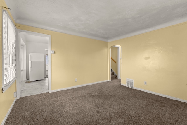 spare room with light colored carpet