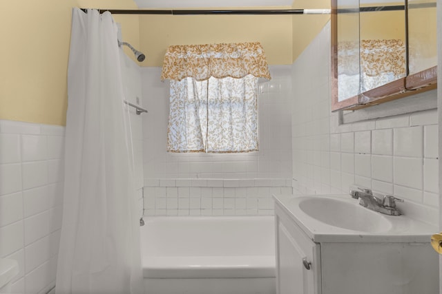 bathroom featuring vanity, tile walls, and shower / tub combo with curtain