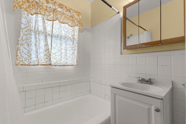 bathroom with vanity, shower / bath combo, backsplash, and tile walls