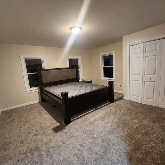 8789 Fowlerville Rd, Fowlerville, MI 48836 - carpeted bedroom with a closet and baseboards