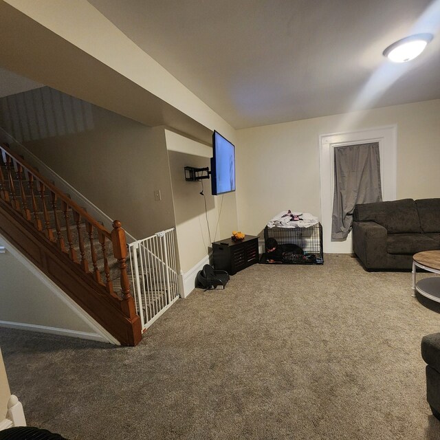 8789 Fowlerville Rd, Fowlerville, MI 48836 - living room featuring carpet floors, stairway, and baseboards