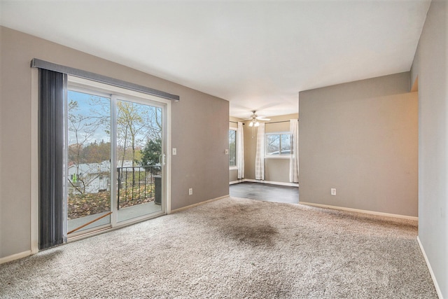 carpeted empty room with ceiling fan