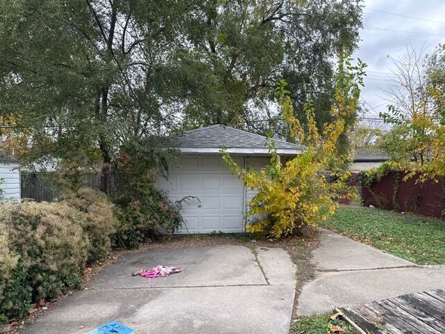 exterior space with an outdoor structure and a garage