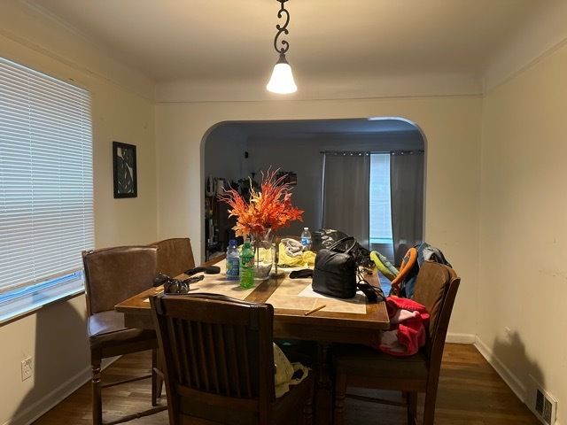 dining area with dark hardwood / wood-style floors