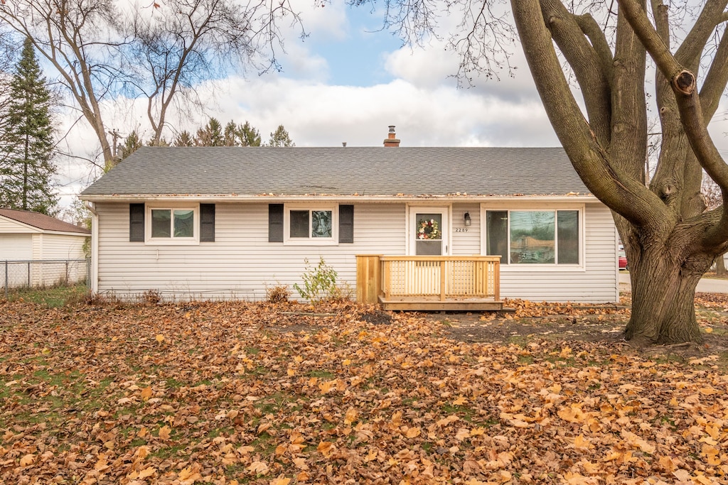 single story home featuring a deck