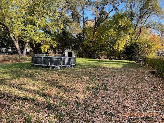 4209 Occidental Hwy, Adrian, MI 49221 - view of grassy yard featuring an outdoor pool