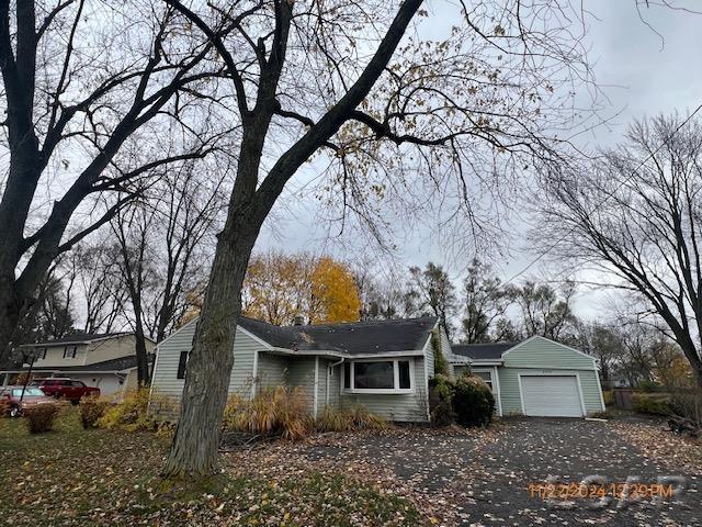4209 Occidental Hwy, Adrian, MI 49221 - view of home's exterior with a garage and driveway