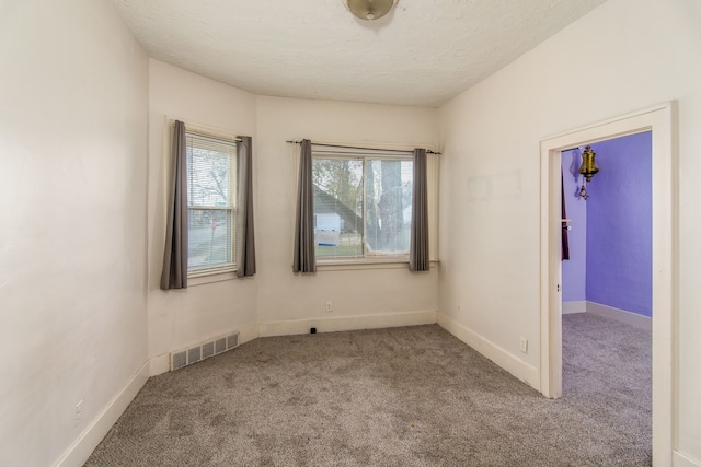 unfurnished room with light colored carpet