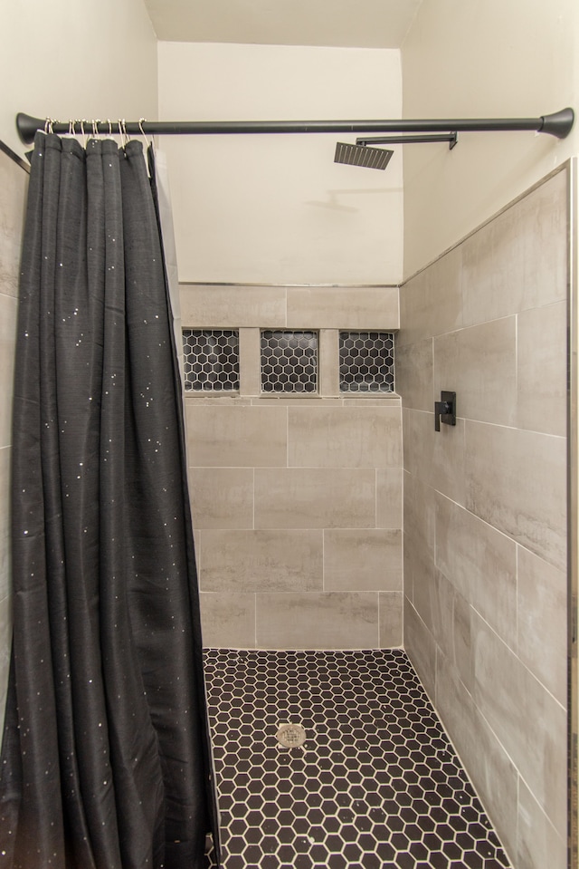 bathroom with a shower with shower curtain