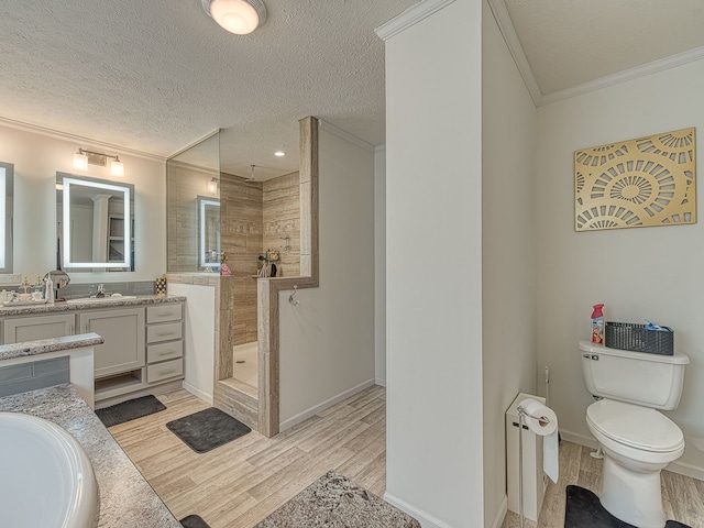 bathroom featuring a shower, vanity, wood-type flooring, and a textured ceiling