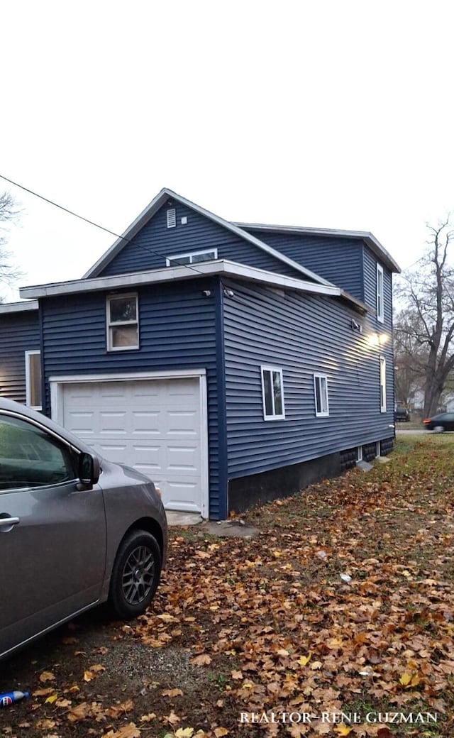 view of property exterior featuring a garage