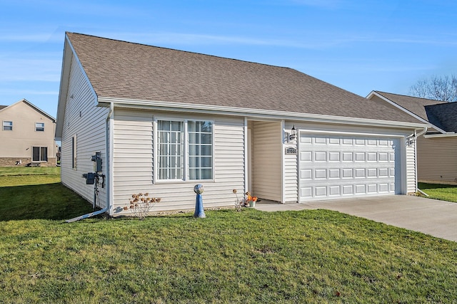 view of front of property with a garage and a front lawn