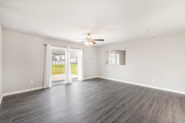 unfurnished room featuring ceiling fan and dark hardwood / wood-style flooring