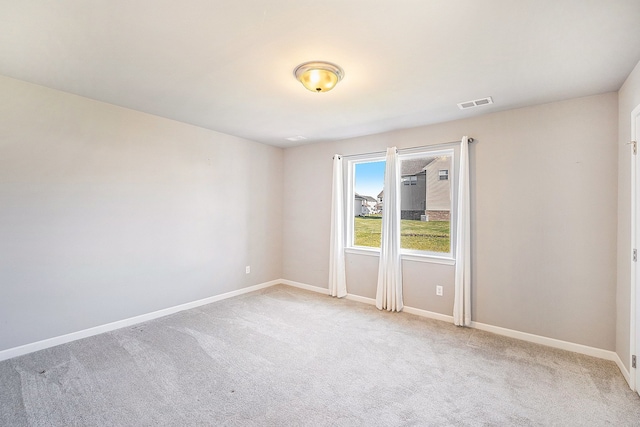 empty room with light colored carpet