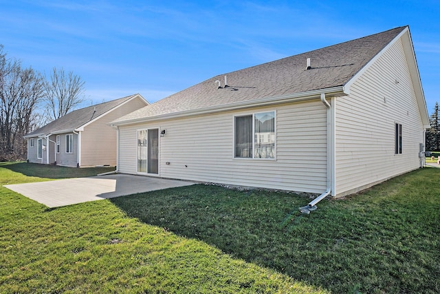 rear view of property with a patio area and a lawn