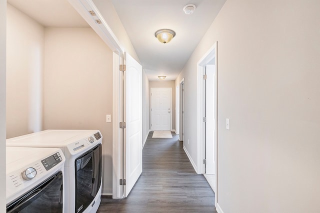 laundry area featuring dark hardwood / wood-style floors and washing machine and clothes dryer